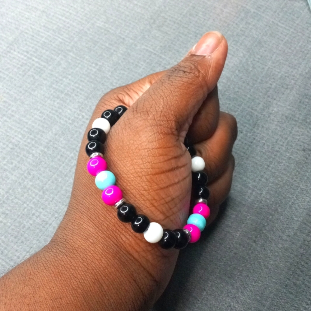 Pink, Baby Blue, White, And Black Beaded Bracelet.